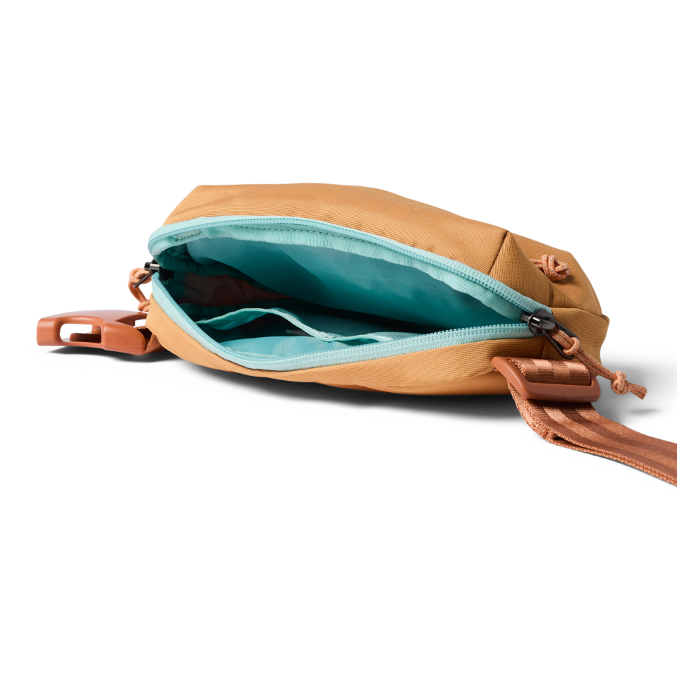 Todo hip pack open showing main compartment and slip pocket