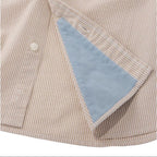 Close-up of khaki stripe seersucker fabric on LL Bean performance shirt hem