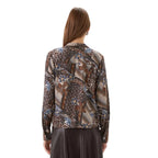 Back view of Karen Kane Long Sleeve Bow Top in blue and brown patchwork print