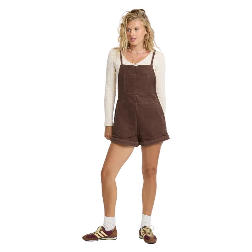 Full-body view of model wearing Billabong Wild Pursuit Corduroy Overall Romper in Teak