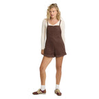 Full-body view of model wearing Billabong Wild Pursuit Corduroy Overall Romper in Teak