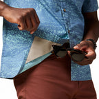 Built-in microfiber sunglass-cleaning cloth detail on the hem of the Cotopaxi Estival Button Up Shirt