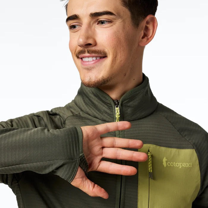 Man wearing a fatigue  jacket with a sports cuff on a white background