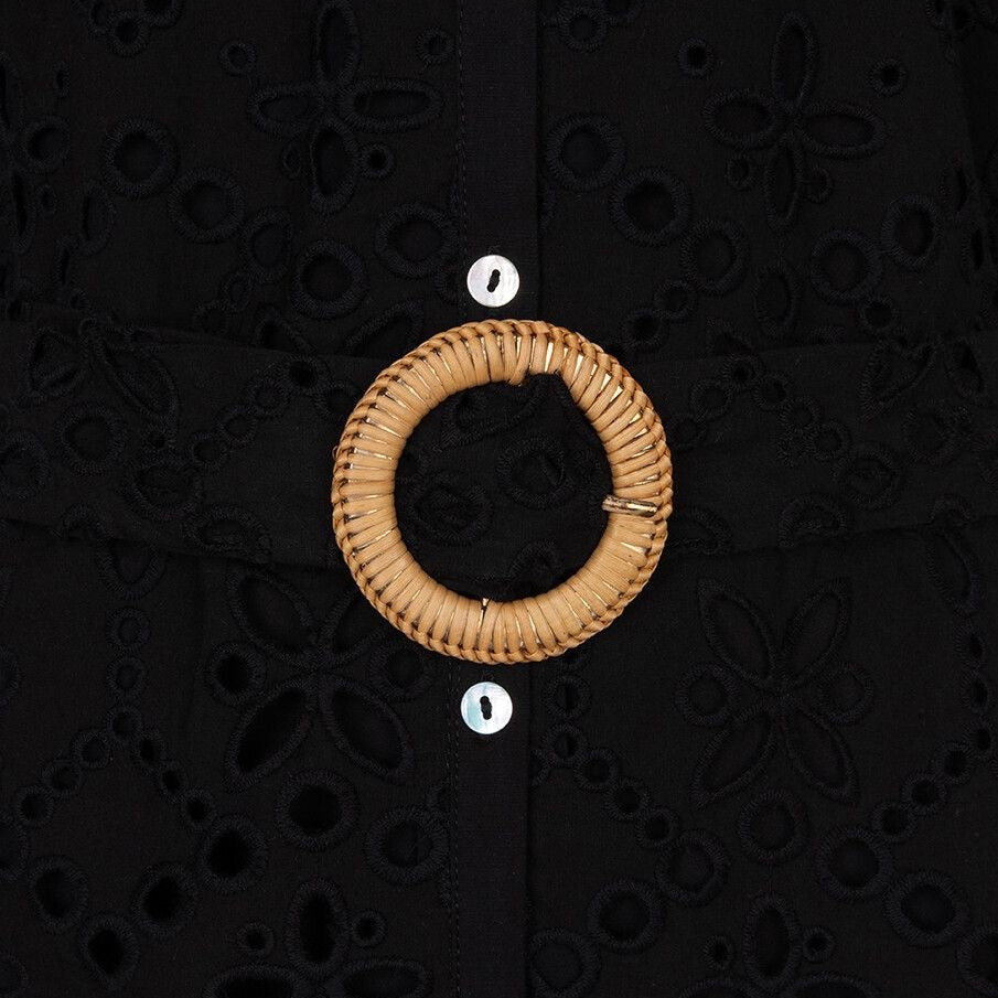 Close-up of broderie anglaise eyelet embroidery detail