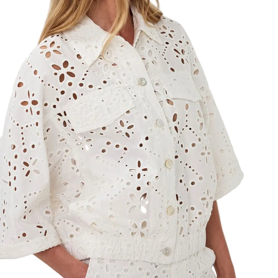 Close-up of the Esqualo Jacket Broderie Anglaise in Natural highlighting the intricate cotton embroidery and textured detailing