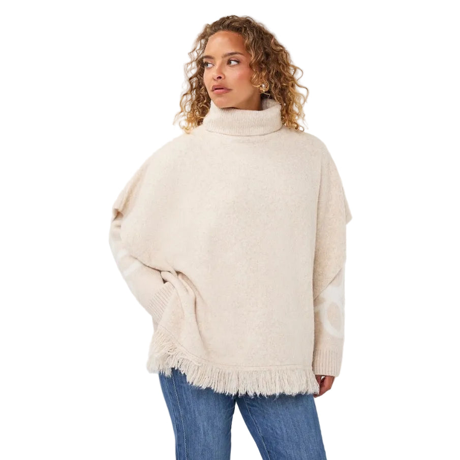 EsQualo Knit Turtleneck Poncho in Biscuit front view with ribbed turtleneck, side buttons and fringe hem