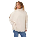 EsQualo Knit Turtleneck Poncho in Biscuit front view with ribbed turtleneck, side buttons and fringe hem