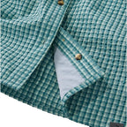 ExOfficio No Fly Zone Seersucker Explorer Shirt Plaid in Dark Salmon hem detail showing textured seersucker fabric