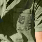 Howler Bros Pilgrimage Polo chest pocket detail with El Monito embroidery