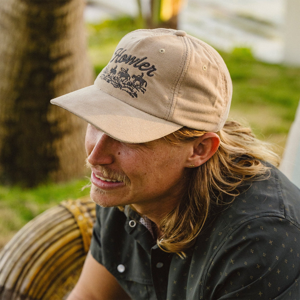 Model wearing Howler Bros Standard Hat in Khaki Corduroy