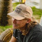 Model wearing Howler Bros Standard Hat in Khaki Corduroy