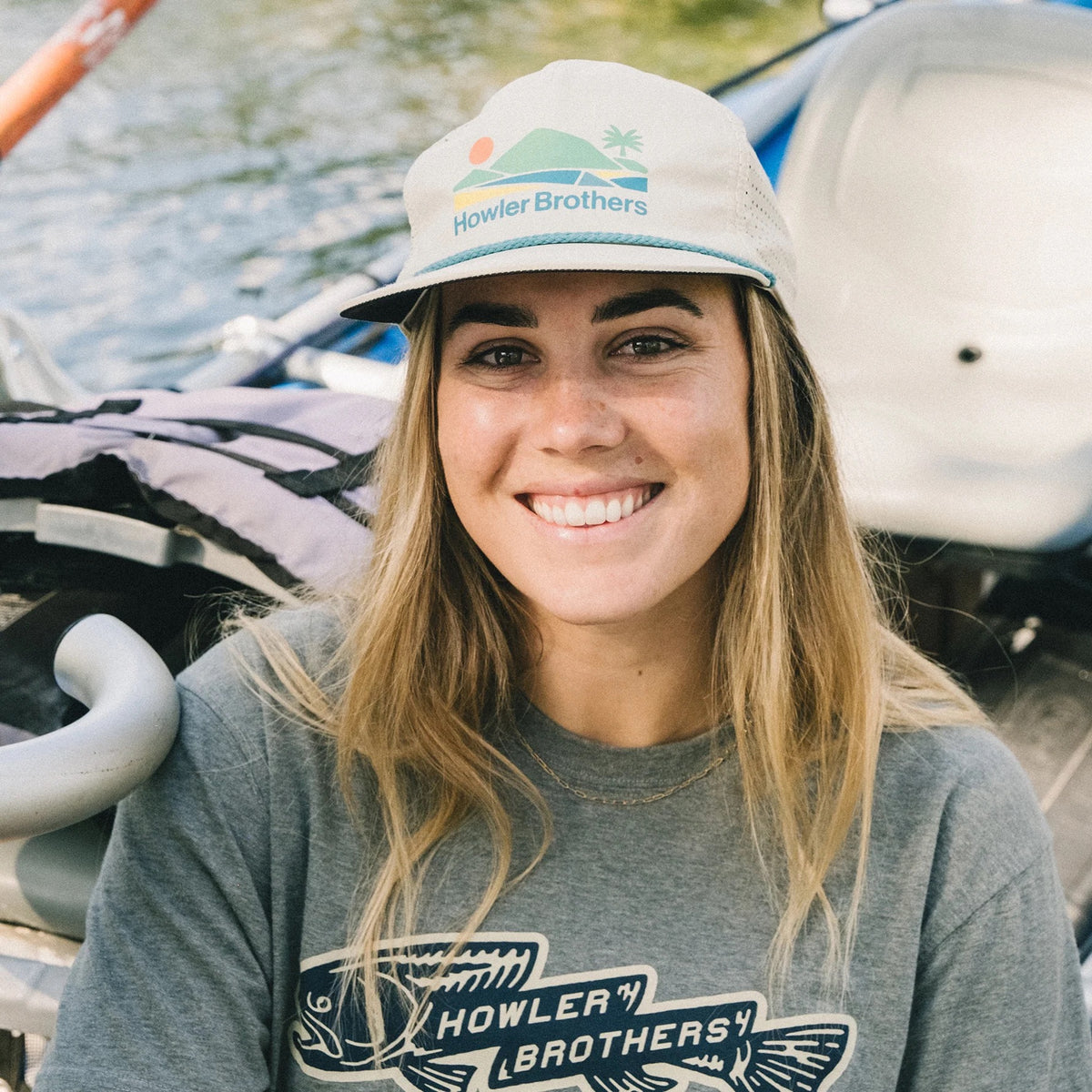 Howler Brothers Aperture Tech Strapback Hat in Bahía de Howler / Stone worn while rafting