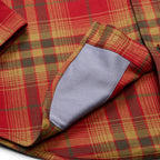 Detailed view of the microfiber and plaid pattern on Howler Brothers Harker’s Flannel in Brick