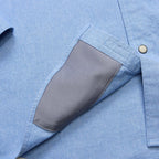 Detail of Howler Brothers Men's Crosscut Deluxe Longsleeve microfiber sunglass cleaner in Fanned Flora Faded Blue Oxford