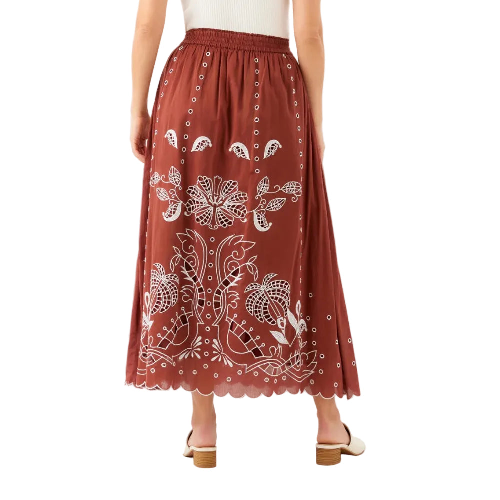 Back view of the skirt highlighting the flowing shape and embroidered fabric.