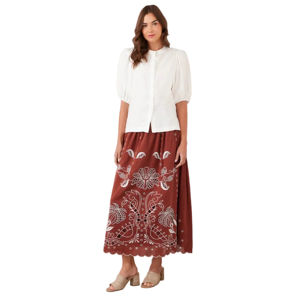 Full-length view showing the elegant drape and midi-length silhouette of the skirt.