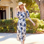 Model wearing Karen Kane Satin Short Sleeve Peasant Top in cream and navy