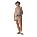 Full-body view of a woman wearing the KAVU Bisbee Tank in Burnt Sugar for casual outings and everyday comfort
