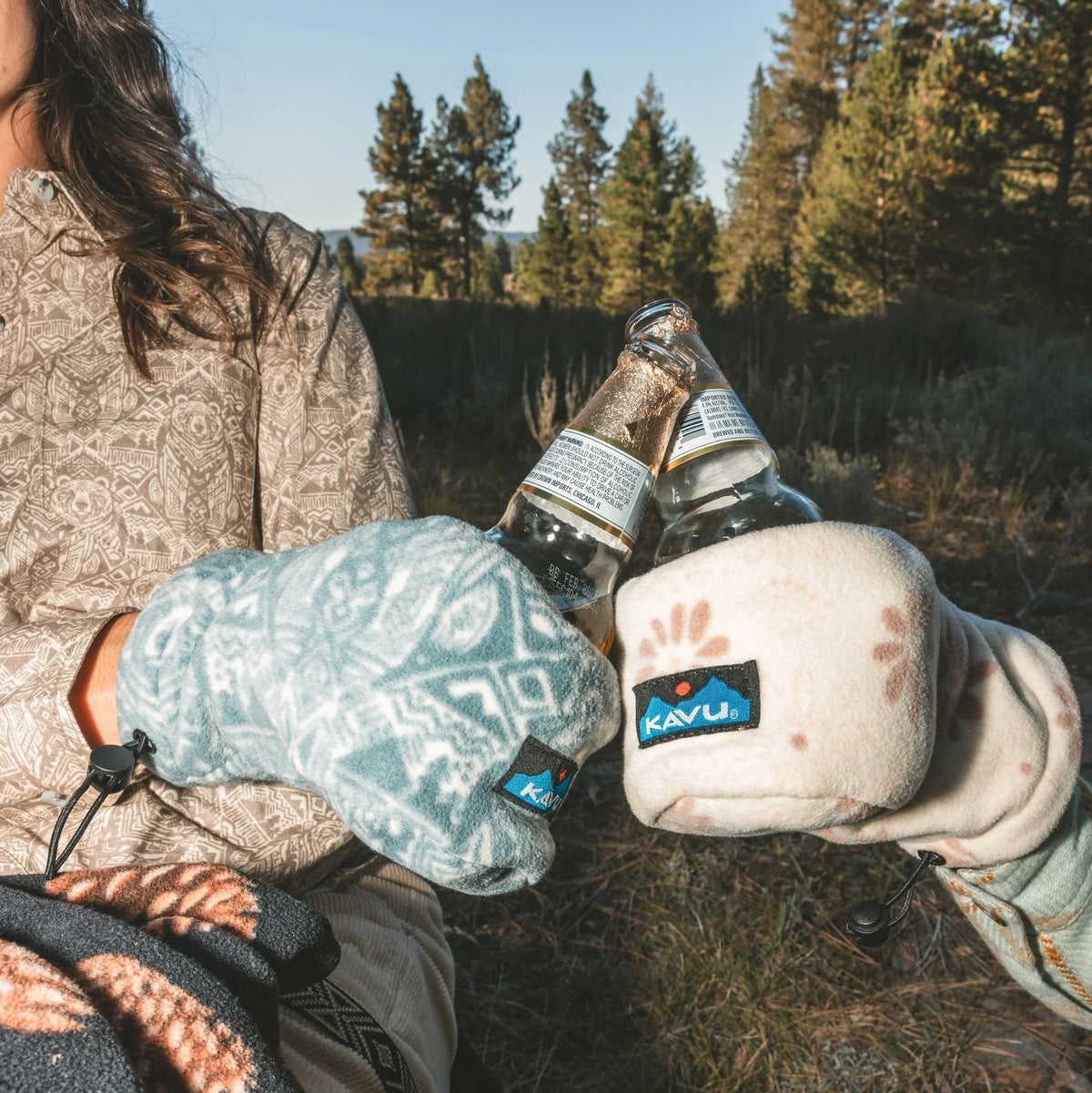 KAVU Drink Mitt in Sky Bear printed recycled fleece with built-in beverage pocket in a lifestyle shot