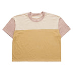 Close-up detail of the KAVU Eevi S/S Tee showing the soft jersey knit fabric and color-block seam construction.