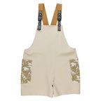 Women's KAVU Montanita Overall in Beige Palm front view featuring a relaxed silhouette and tropical-inspired print