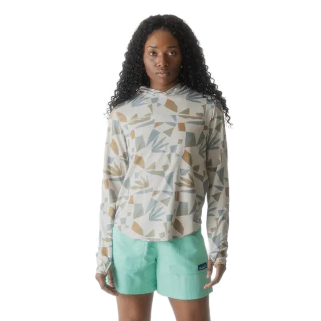 Full-body view of a woman wearing the KAVU Sunshade Hoody in Mod Mix for hiking, paddling, travel, and sunny outdoor adventures