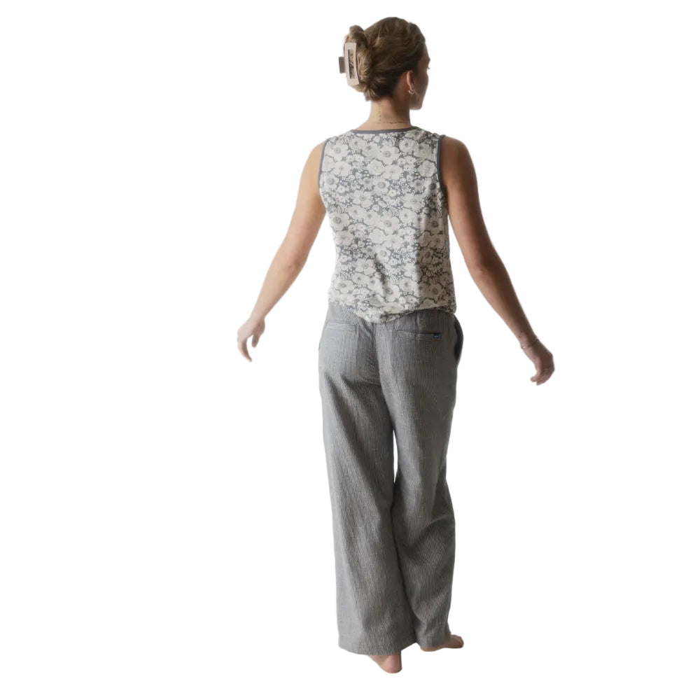 Full-body view of a woman wearing the KAVU Tamarindo Pant in Turbulence for travel, casual outings, and outdoor adventures