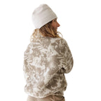 Back view of woman wearing KAVU Women's Loven Jacket in Blown Out Bloom