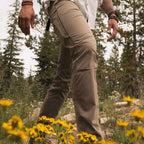 Man wearing KÜHL Free Radikl Pant in Walnut outdoors