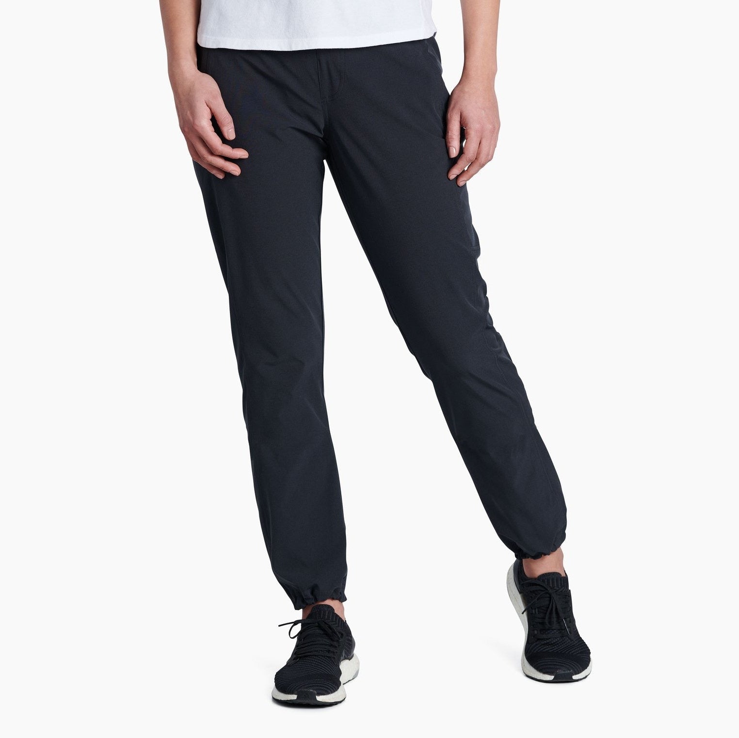 Women's KÜHL FREEFLEX DASH Pant in Koal front view featuring lightweight stretch performance fabric and a flattering outdoor fit