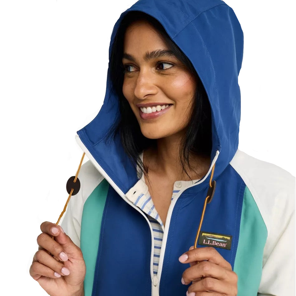 Close-up of the adjustable hood, zipper and colorblock fabric on the L.L.Bean Women’s Mountain Classic Anorak in Mariner Blue and Wood Violet