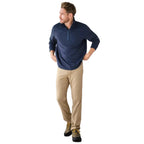 Man wearing LL Bean Venture Stretch 5-Pocket Pant in Dark Driftwood outdoors