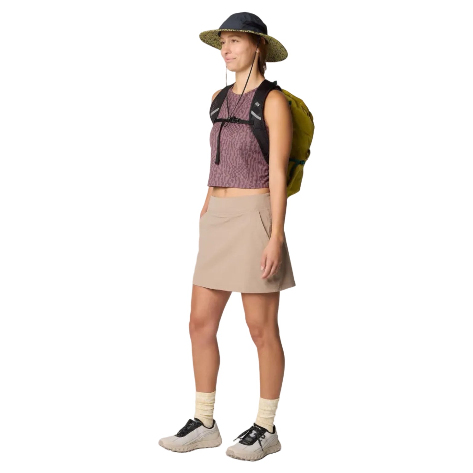 Full-body view of woman wearing the Mountain Hardwear Dynama Skort in Khaki