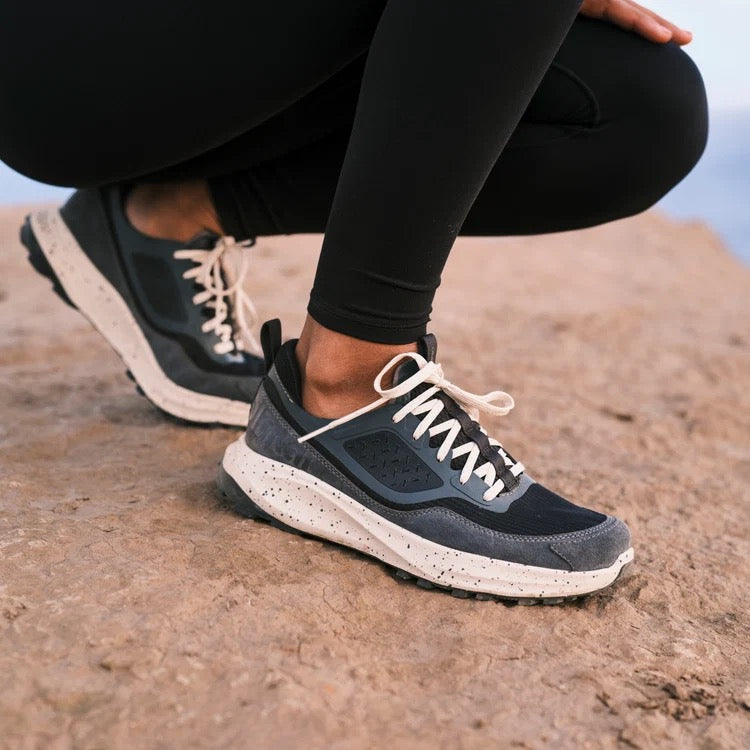 Women’s OluKai Makiki Shoe in Lava Rock/Dark Shadow worn for all-terrain adventures and everyday comfort