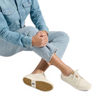 Women’s OluKai Pehuea Lī ‘Ili Shoe in White/White worn with a casual everyday outfit