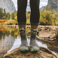 PAKA Essential Mountain Crew Socks in Mountain with alpine graphic worn in the great outdoors