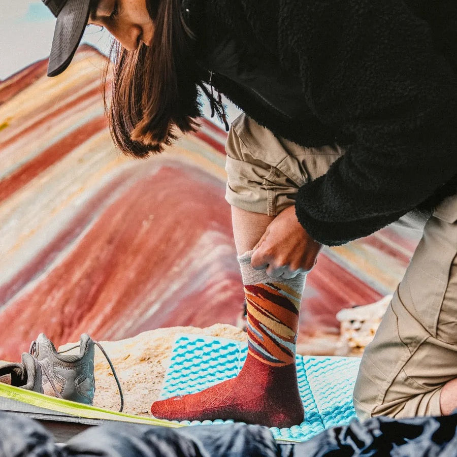 PAKA Essential Rainbow Mountain Crew Socks in Clay with colorful mountain-inspired pattern lifestyle image
