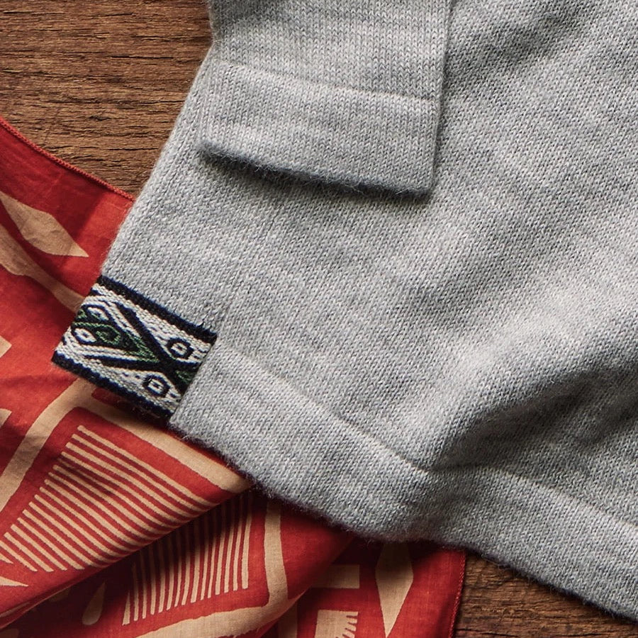 PAKA The Original Crew in Light Grey showing soft alpaca knit and hem detail