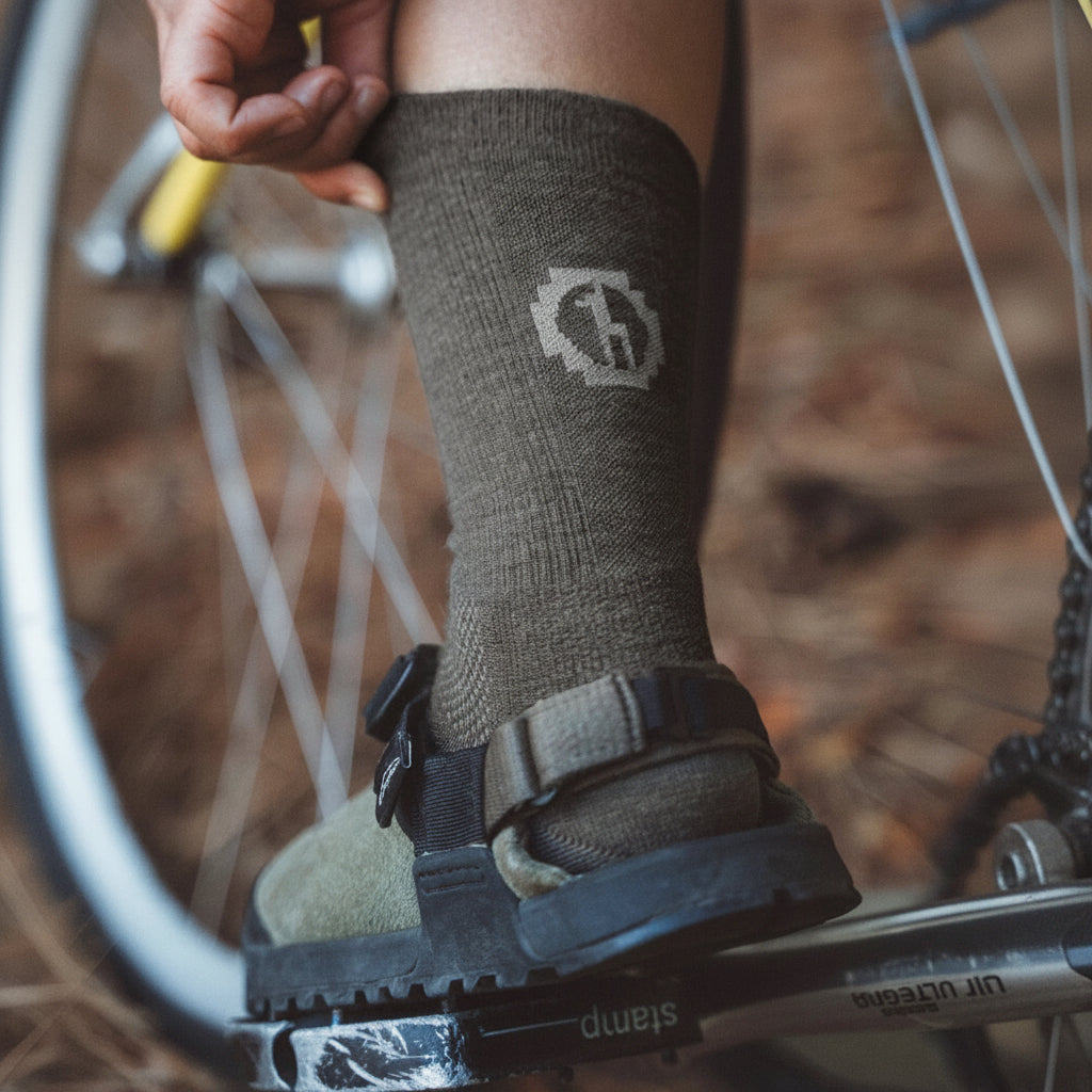 PAKA Trail Crew Socks in Forage with ribbed crew height and cushioned footbed lifestyle view