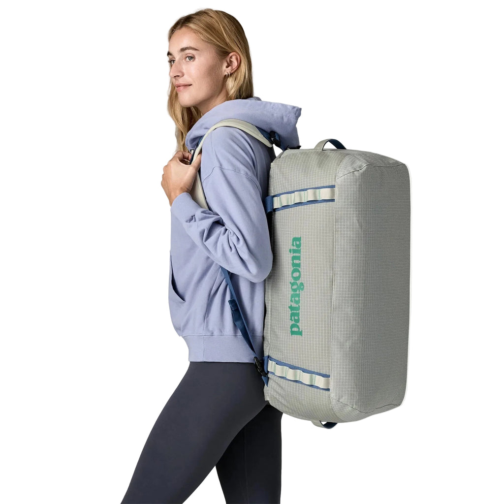 Patagonia Black Hole Duffel 55L in Birch White backpack on model