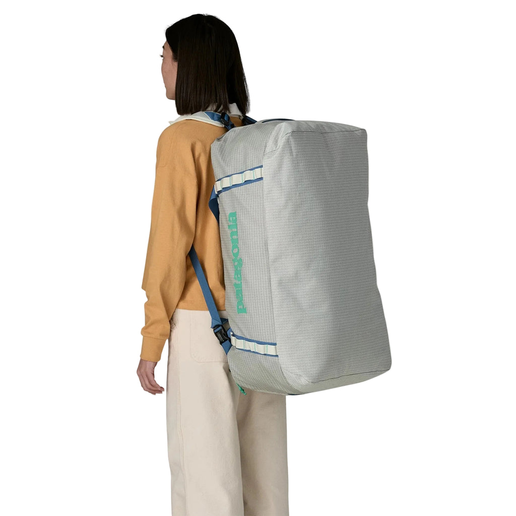 Patagonia Black Hole Duffel 70L in Birch White backpack version on model