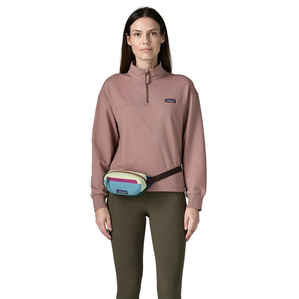 Patagonia Terravia Mini Hip Pack 1L in Berry Fig on model around waist