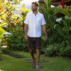 REEF Men’s Phantom Tradewind Sandal Tan man wearing in tropical setting