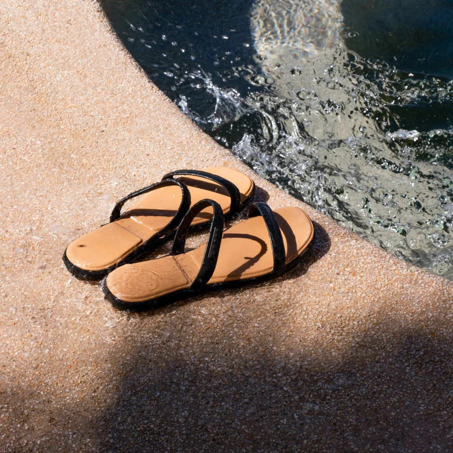 REEF Water Willow Marina Black/Tan pair by the water view