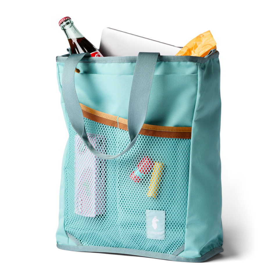Cotopaxi Todo tote mesh side pockets holding chapstick and showing laptop sleeve