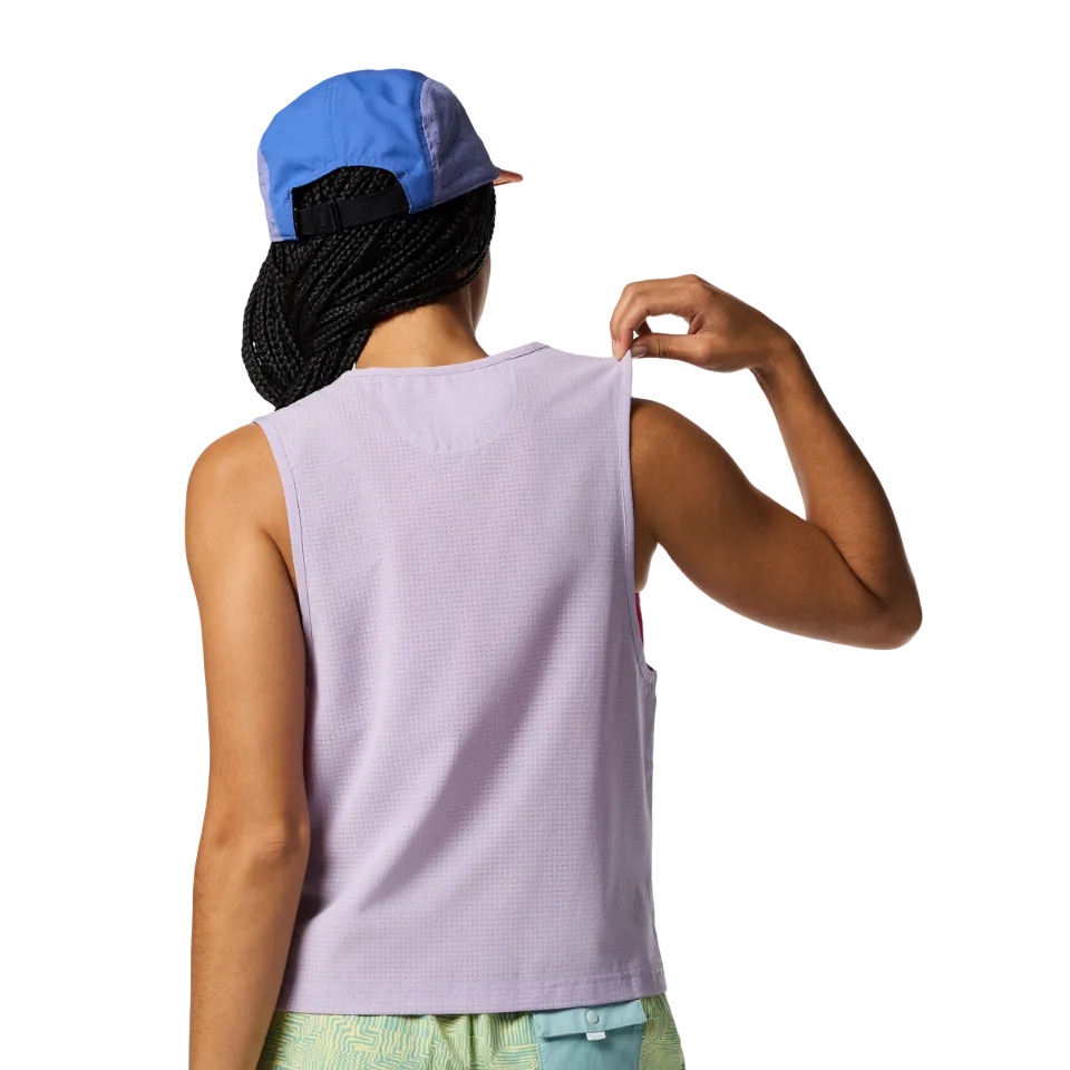 Cotopaxi tank layered over sports bra