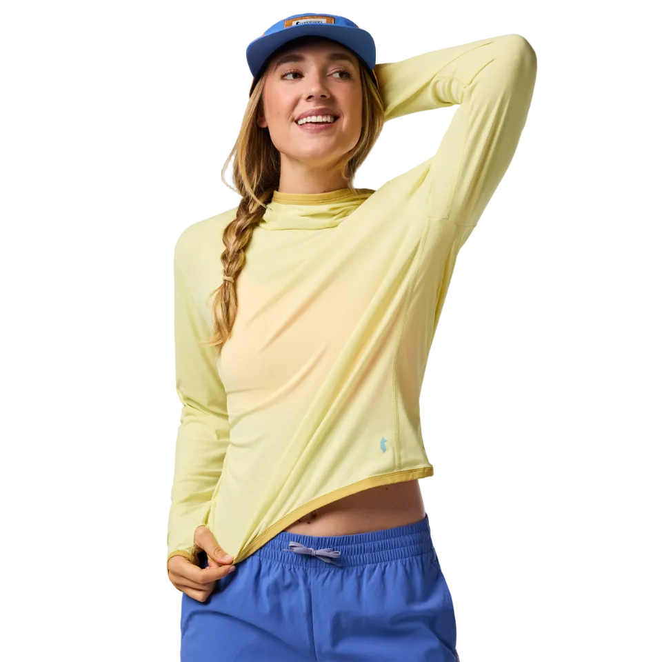 Woman wearing a honeydew yellow sun hoodie with hat