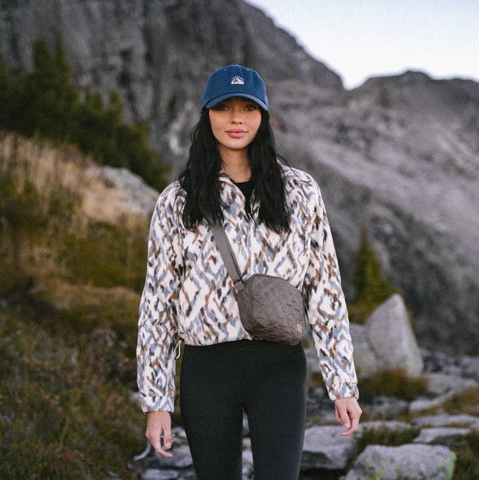 tentree Women’s Palisade Full Zip in White Oak/Sunset Plains worn outdoors