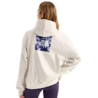 The North Face Women’s Evolution Moon Florals Oversize Hoodie in White Dune showing back floral graphic
