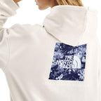 Detail view of The North Face Women’s Evolution Moon Florals Hoodie in White Dune